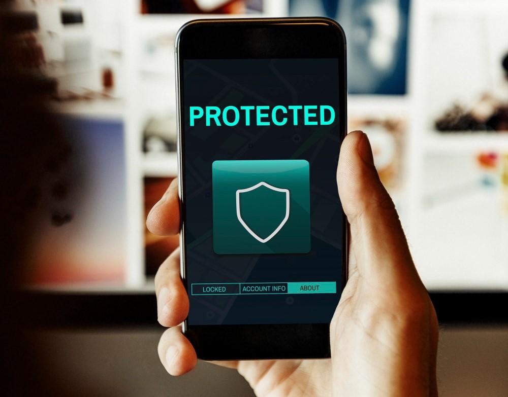 Image of someone holding a secured smartphone.